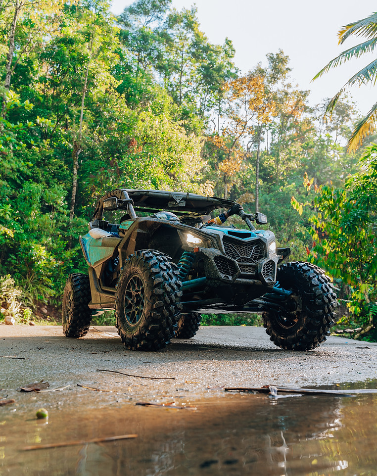 Blue Can-Am Maverick UTV on a forest trail during an Avivaa tour in Haiti
